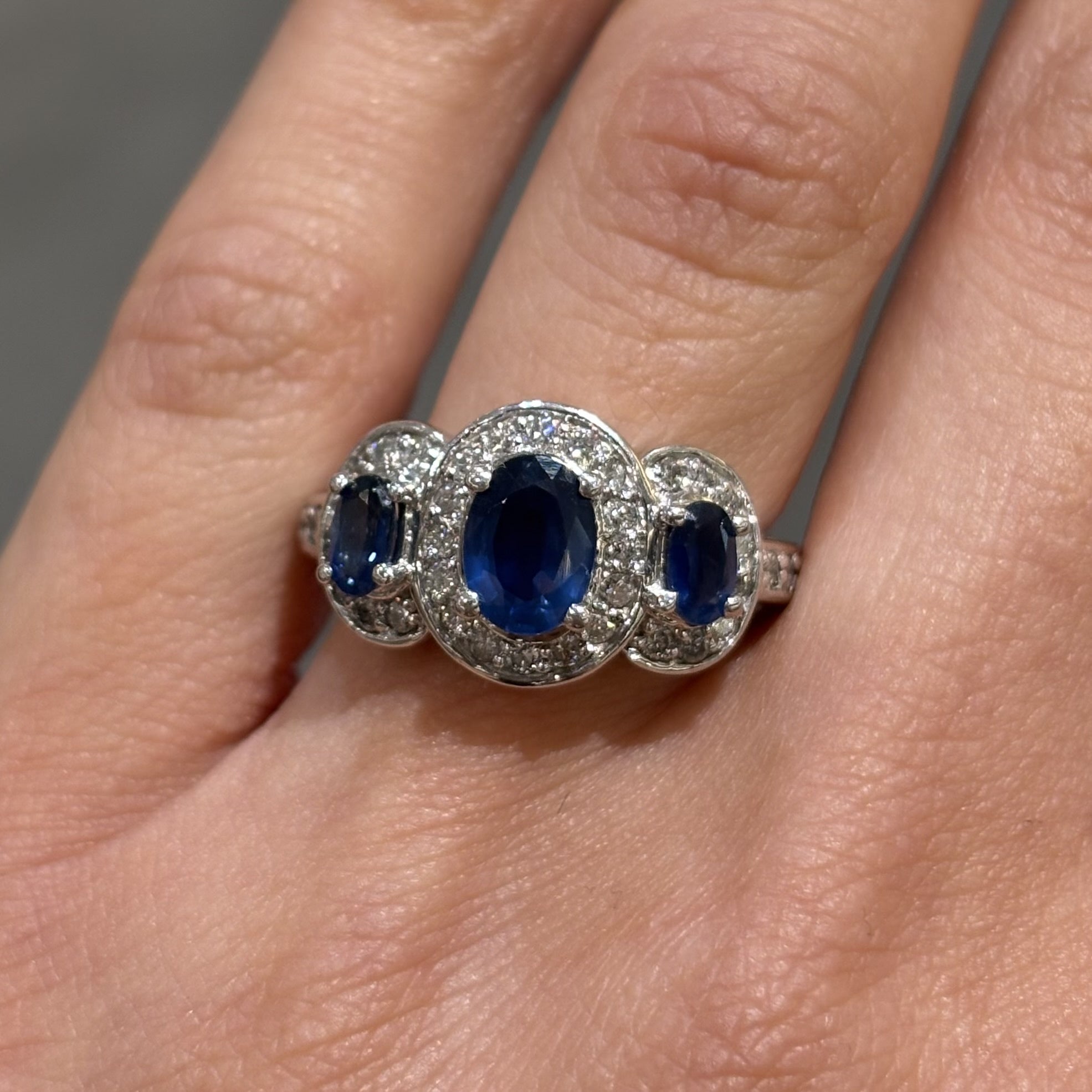 Pre-Owned 14ct White Gold 1.33ct Three Stone Sapphire 0.48ct Diamond Halo Style Ring