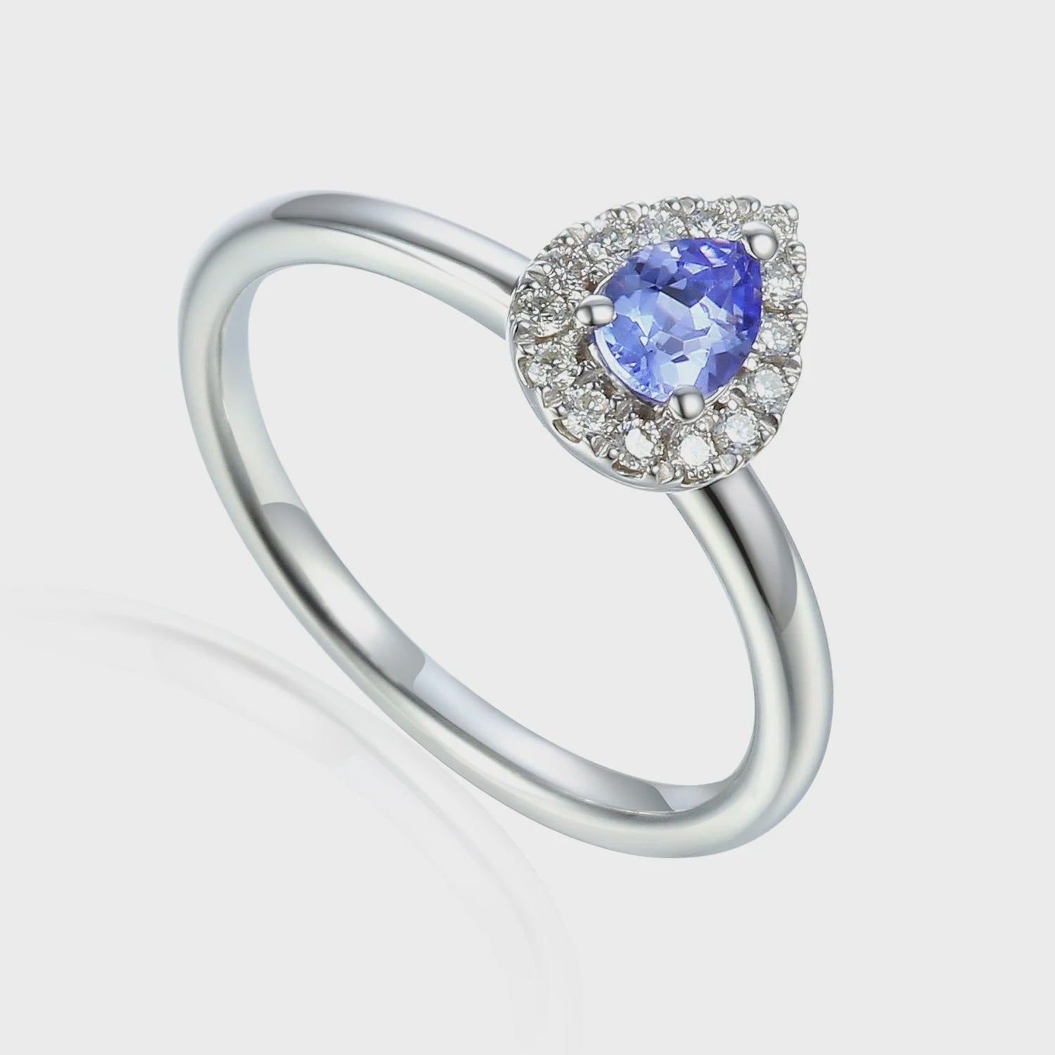 9ct White Gold 30pt Tanzanite &amp; 13pts Diamond Halo Ring